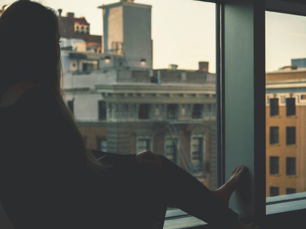 A girl looking out of window