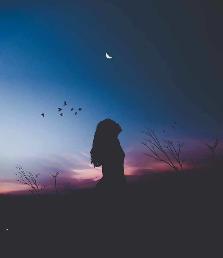 a Sleepless girl looks at night sky 