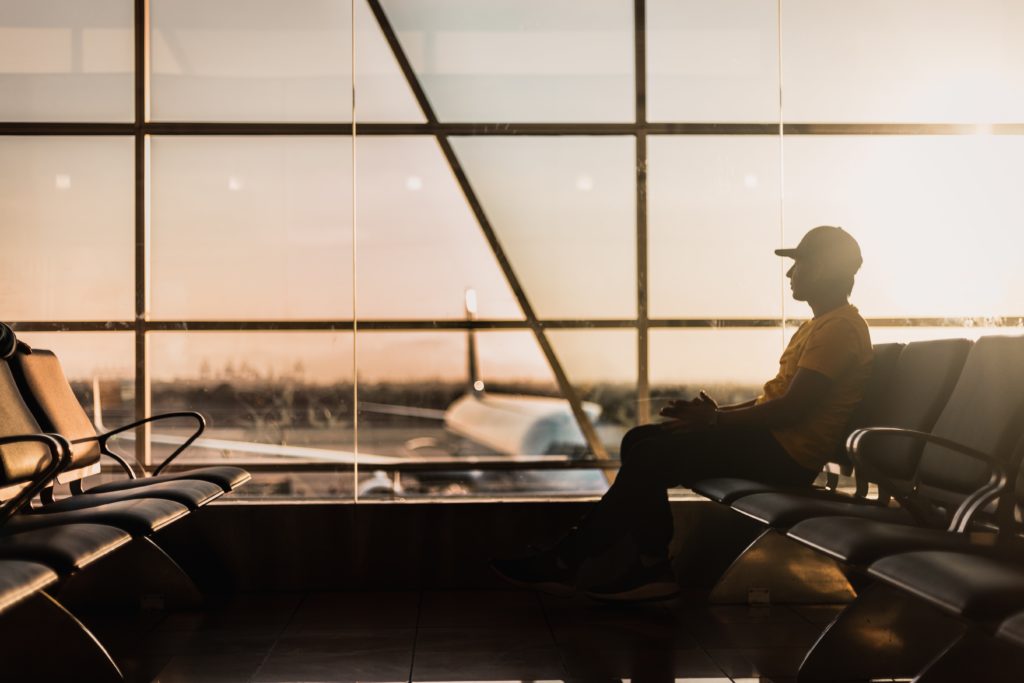 man waiting at airport