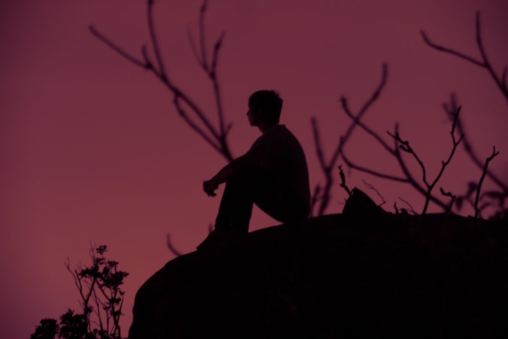 silhouette of a man sitting