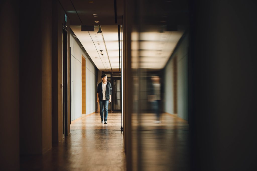 Boy walking on school corridor